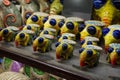 Yellow-blue statuettes on the counter in Lviv. Sale of souvenirs in Ukraine.