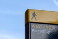 Yellow and blue West End Piccadilly sign on clear sky. Place for text