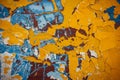 Yellow, blue, white, brown abstract vintage background. Old peeling paint on the wood surface, weathered texture Royalty Free Stock Photo