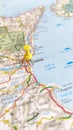 A yellow board pin stuck in Catania on a map of Sicily portrait Royalty Free Stock Photo