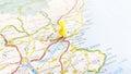 A yellow board pin stuck in Dundee on a map of Scotland