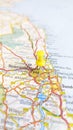 A yellow board pin stuck in Newcastle Upon Tyne on a map of England portrait Royalty Free Stock Photo