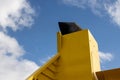 Yellow boat chimney and a cloudy sky