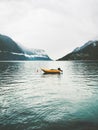 Yellow boat in sea fjord and foggy Mountains Landscape Royalty Free Stock Photo
