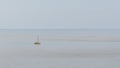 Yellow boat stopped in a calm sea