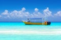 Yellow boat on a tropical beach