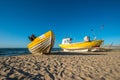 A yellow boat and yellow fishing boat on the beach Royalty Free Stock Photo