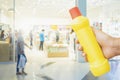 Yellow bottle for cleaning staff in home blurred background Metaphor for cleaning Get rid of germs In bathroom, home office or Royalty Free Stock Photo