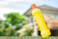 yellow bottle for cleaning staff in home blurred background Metaphor for cleaning Get rid of germs In bathroom, home office or Royalty Free Stock Photo