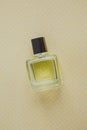 yellow bottle of perfume on a yellow background