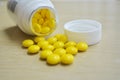 Yellow bottle with pills Royalty Free Stock Photo