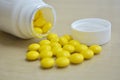 Yellow bottle with pills Royalty Free Stock Photo