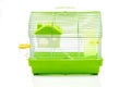 A yellow box in a small yellow hamster cage.