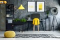 Dark work area with pouf