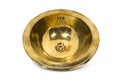 Yellow brass round sink on white background. Royalty Free Stock Photo