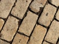 Yellow brick road. Yellow stone tiles masonry closeup background. the texture of yellow antique paving stones. Old yellow pavement Royalty Free Stock Photo