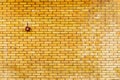 Yellow brick wall with fire alarm button Royalty Free Stock Photo