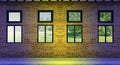 Yellow brick wall and light windows Royalty Free Stock Photo