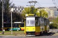 Yellow bright modern close-up trams in Sunny weather in the autumn European city of Warsaw, Poland. Comfortable public transport