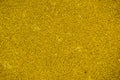 Yellow bright soft rubber flooring safe for sports and workout or on the playground from the many small round pebbles pressed. Royalty Free Stock Photo