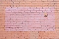 Yellow and brown brick wall with painted splotch Royalty Free Stock Photo