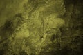 Yellow brown green rough surface. Toned old concrete wall. Close-up. Mustard green color. Grunge background. Royalty Free Stock Photo