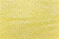 Yellow bubble wrap foil on yellow backgound