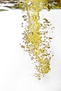 Yellow bubbles in water on white background