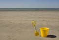 Yellow bucket and spade Royalty Free Stock Photo