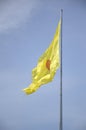 yellow buddha flag on blue sky Royalty Free Stock Photo