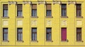 Yellow building face with windows Royalty Free Stock Photo