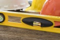 Yellow building level on the wood table Royalty Free Stock Photo