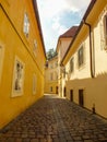 Yellow Buildings in Prague Alley, the Old City, Praha Narrow Street with cobblestones, Alleyway, Jewish Quarter, Czech Republic