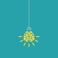 Yellow bulb with brain and rays on nlue background. New idea, intellect sign. smart, clever, creative symbol