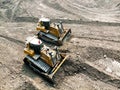 Yellow bull dozer is working in coal mine. Royalty Free Stock Photo