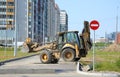 Yellow bulldozer at the final stage of construction