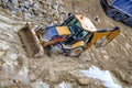 Yellow bulldozer in loam soil