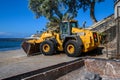 A yellow bulldozer works on the Costa Adeje beach. 08.01.2020 Tenerife, Canary Islands