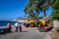 A yellow bulldozer works on the Costa Adeje beach. 08.01.2020 Tenerife, Canary Islands