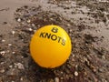 Yellow Buoy on the beach