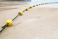 Yellow buoy and rope Royalty Free Stock Photo