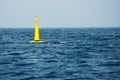 Yellow buoy on sea
