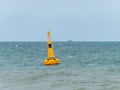 Yellow buoy at sea to mark a danger area