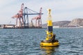 Yellow Buoy with Sea Lion and Shipping Cranes in Ensenada, Mexico