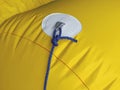 Yellow buoy texture with blue rope and nautical knot called
