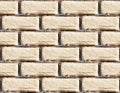 Yellow burned brick wall seamless background