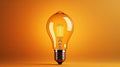 Yellow burning bright incandescent light bulb, concept new Royalty Free Stock Photo