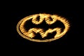 Yellow Burning Flames Effect on Batman Icon Logo against black background