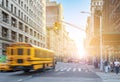 Yellow bus driving fast down Fifth Avenue in Manhattan New York City Royalty Free Stock Photo