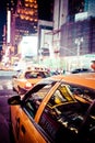 Yellow cab speeds through Times Square in New York.